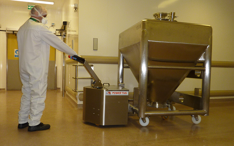 Stainless Steel PowerTug moving Pharmaceutical mixing vessel with 4 swivel castors at GSK